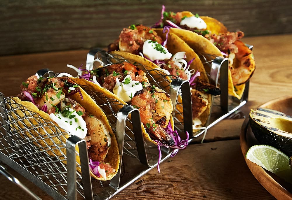 Shrimp tacos served with cabbage, herbs and creamy sauce